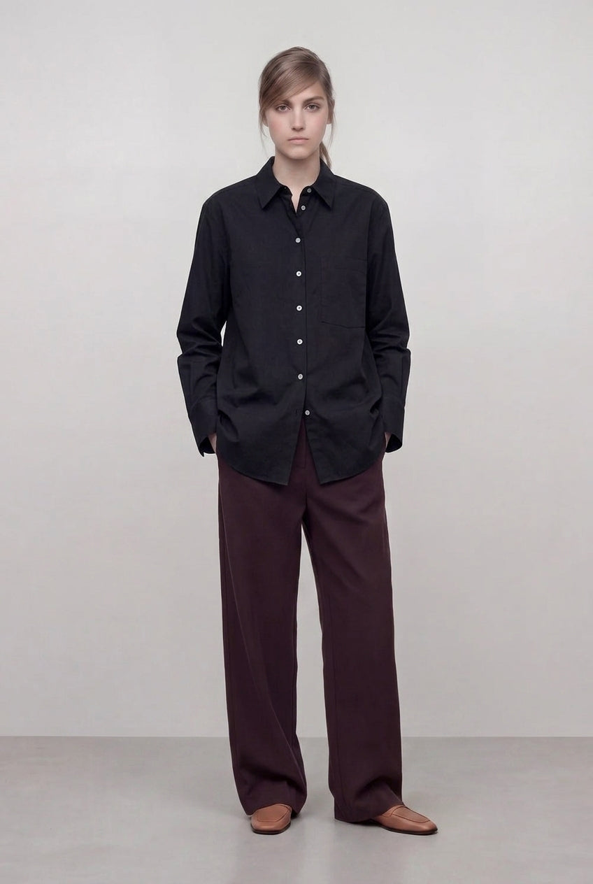 Women wearing a black baby cord shirt in Cotton