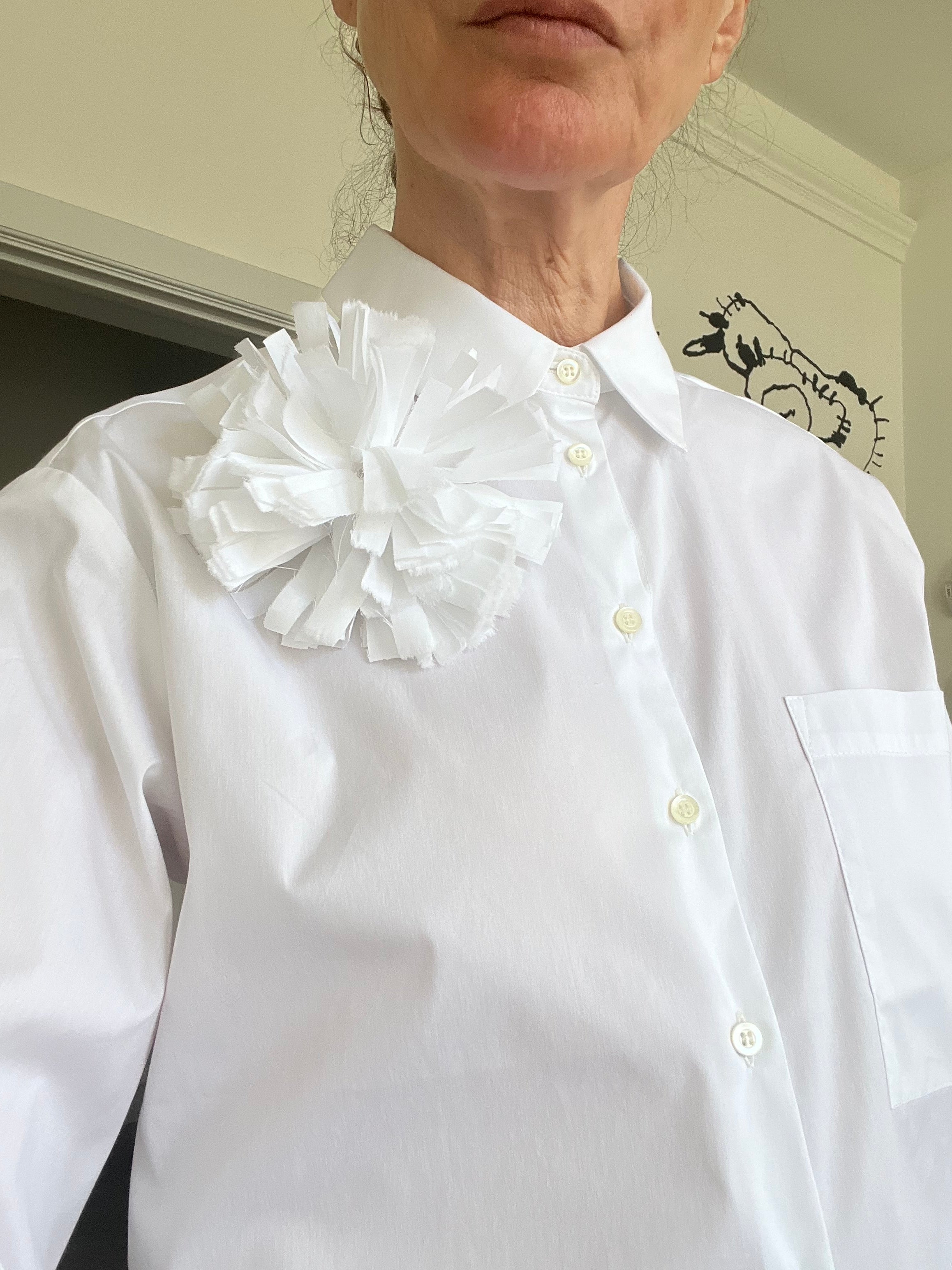 White broche on white shirt 