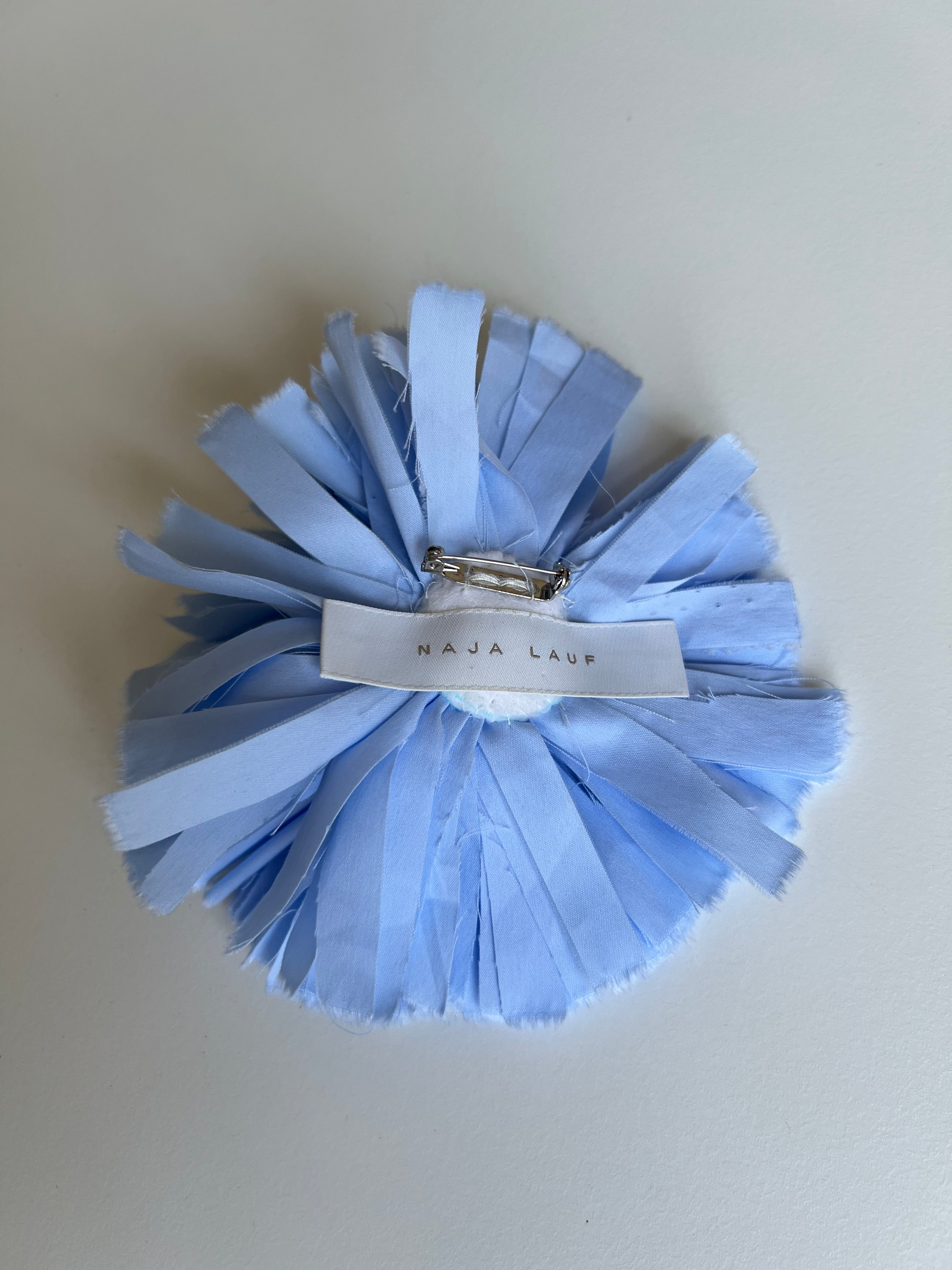 Light blue flower broche in fabric