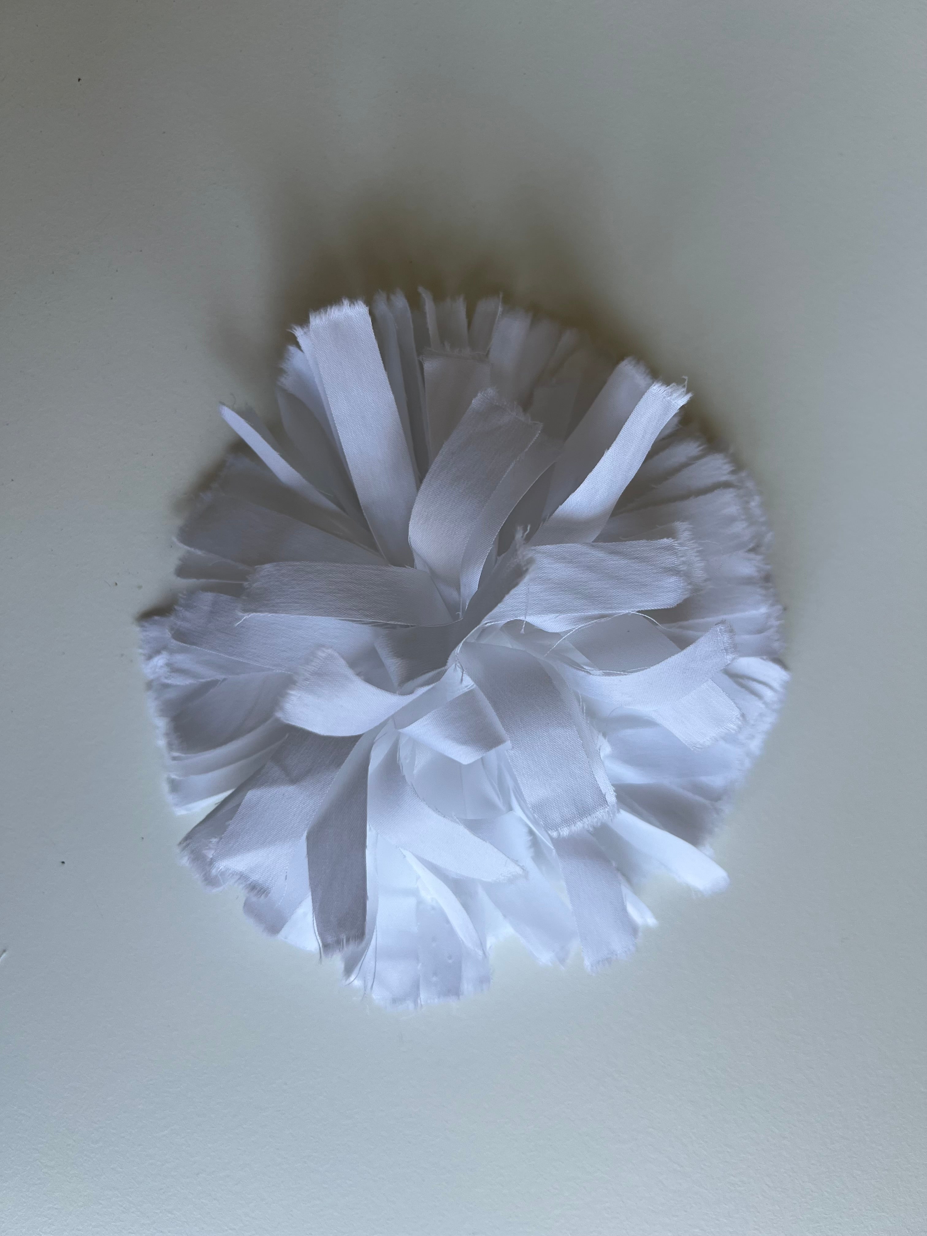 white flower broche in fabric 