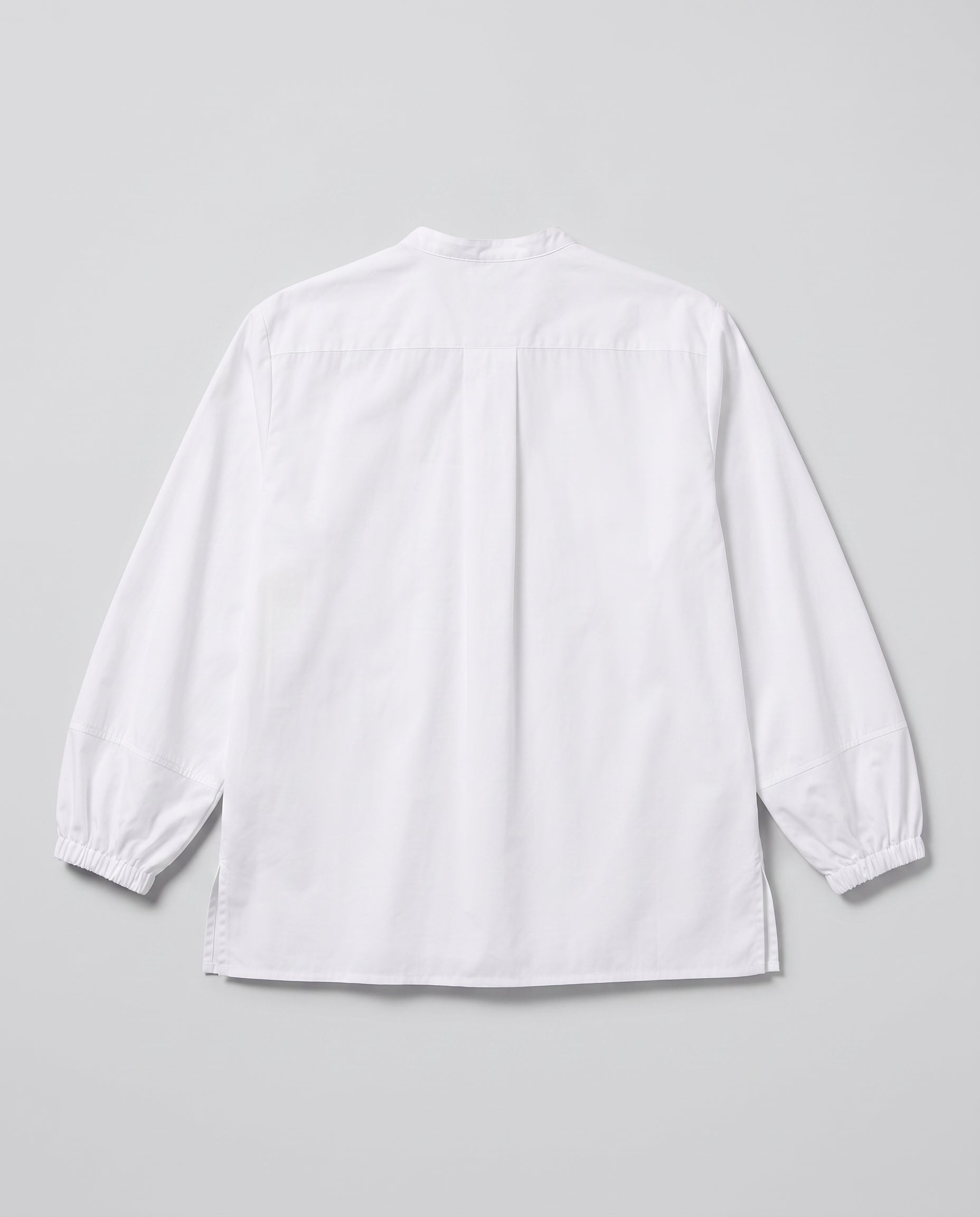 A white long-sleeve shirt with Elastic at cuffs and band collar